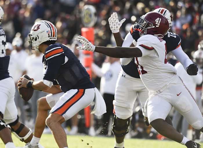 Nov 25, 2023; Auburn, Alabama, USA; Auburn Tigers offensive lineman Izavion Miller (72) blocks as Alabama Crimson Tide linebacker Chris Braswell (41) pressures Auburn Tigers quarterback Payton Thorne (1) at Jordan-Hare Stadium. Mandatory Credit: Gary Cosby Jr.-USA TODAY Sports